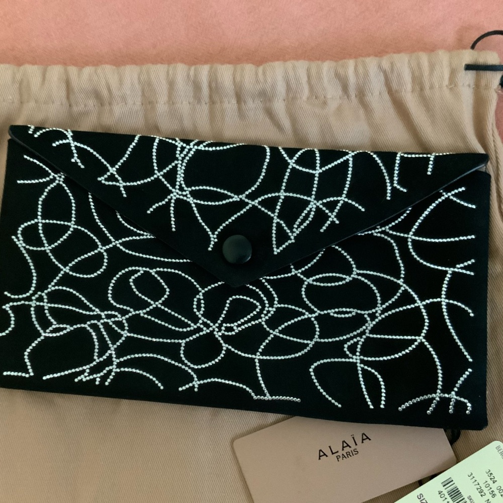 Alaia studded clutch